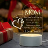 A glowing heart-shaped sign with the message To My Mom I love you and I appreciate you always I love you displayed on a white