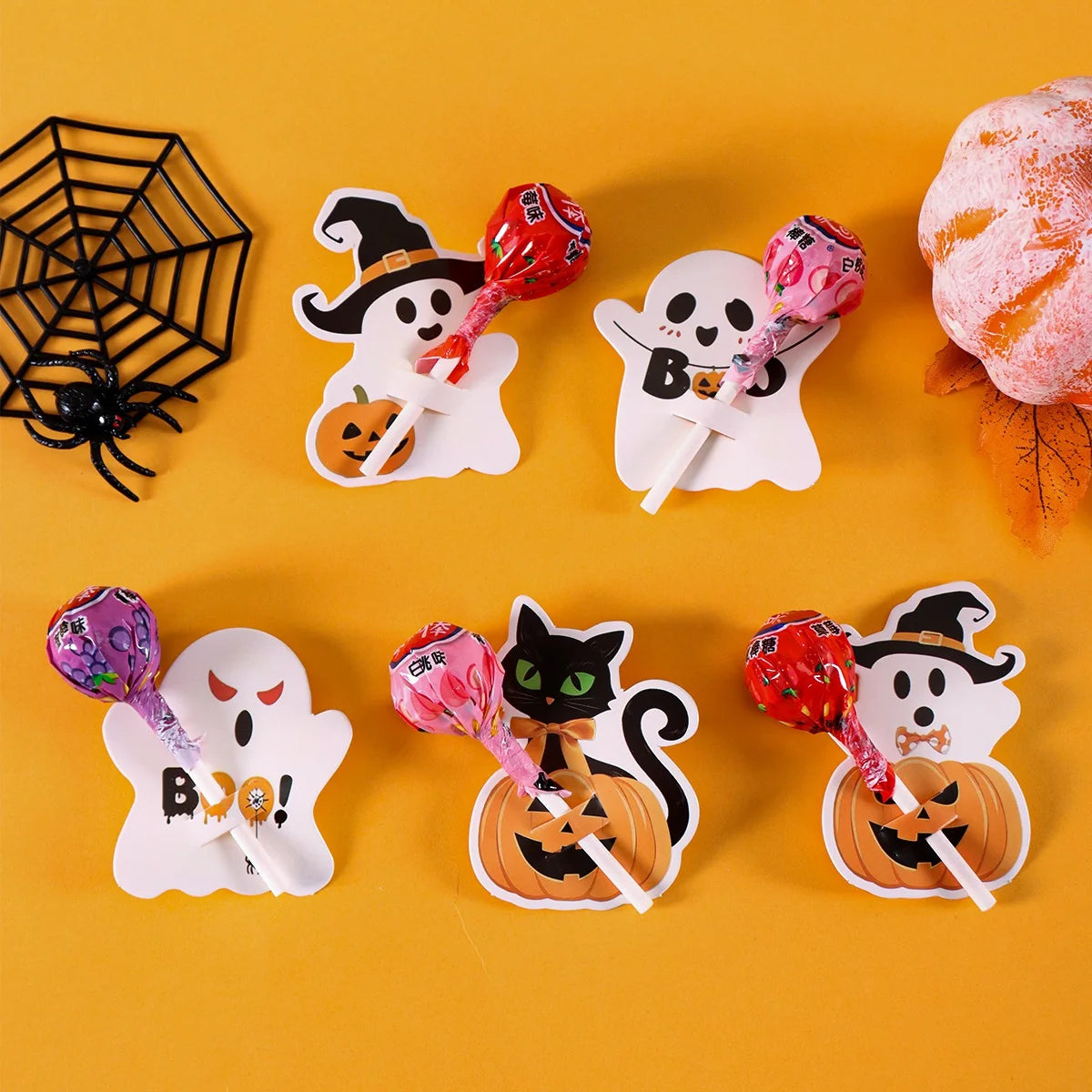 A collection of Halloween-themed lollipop holder cards featuring ghosts and witches on white backgrounds.