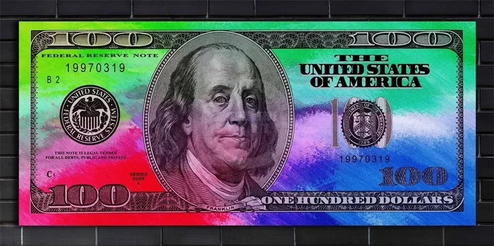 A close-up of a US $100 Federal Reserve Note from 1997, featuring Benjamin Franklin's portrait and green and purple tones.