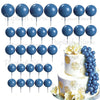 A set of blue and white foam cake toppers, including round discs and a grape cluster arrangement.