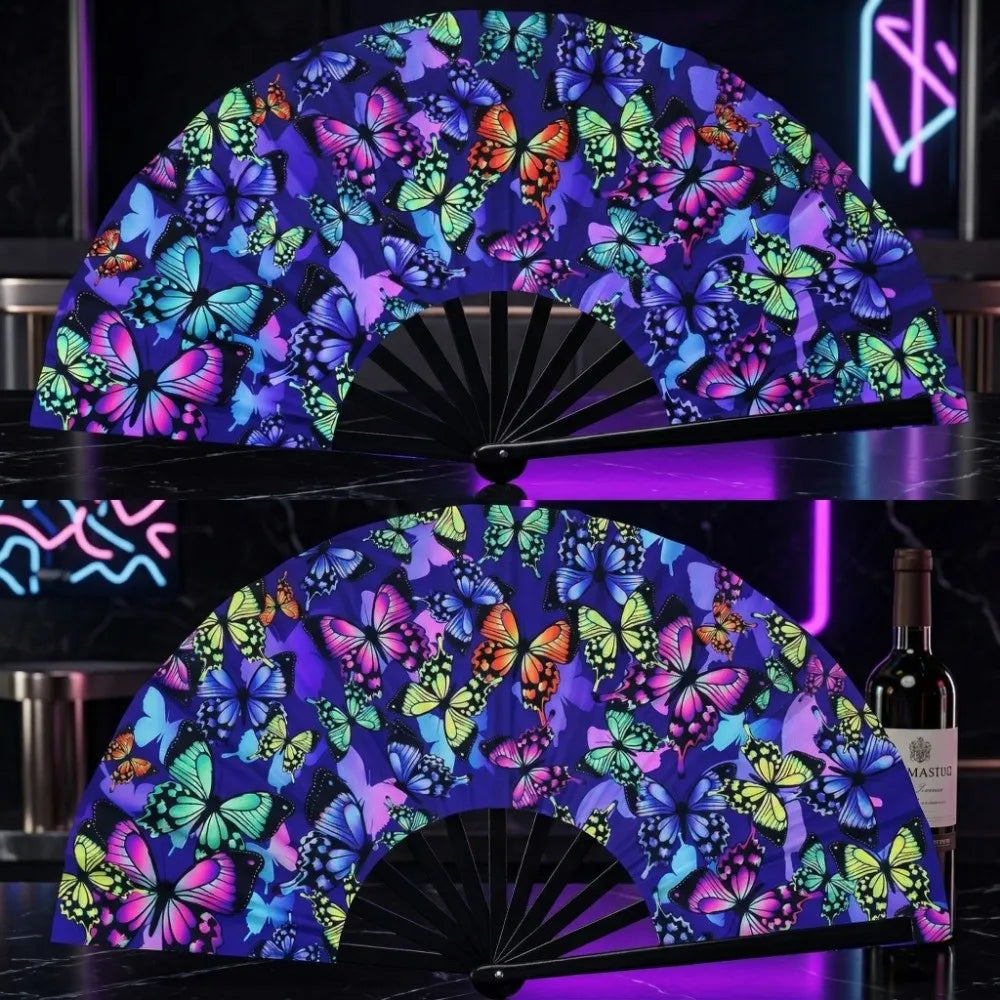A purple and blue fluorescent UV glow folding rave hand fan displayed on a black surface.
