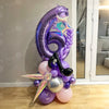 A purple and silver balloon column set shaped like the number 5, featuring musical notes and a saxophone.