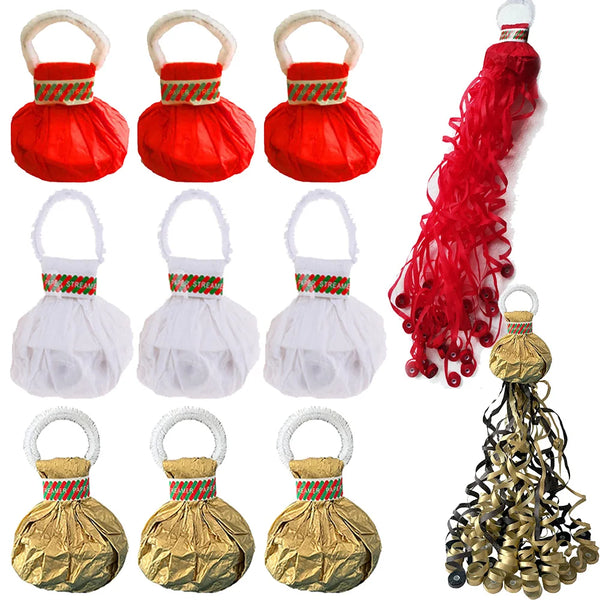 A collection of red and gold paper streamers, including pom-pom shaped decorations and long flowing streamers.
