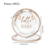 A set of ten round plates with gold accents and floral details for a baby shower or gender reveal event.