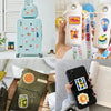 A collection of Mediterranean aesthetic graffiti stickers is shown on a black phone case, next to a green leather laptop slee