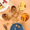 A collection of golden potato sticks and savory snacks are displayed in various disposable kraft paper cups and a blue plate.