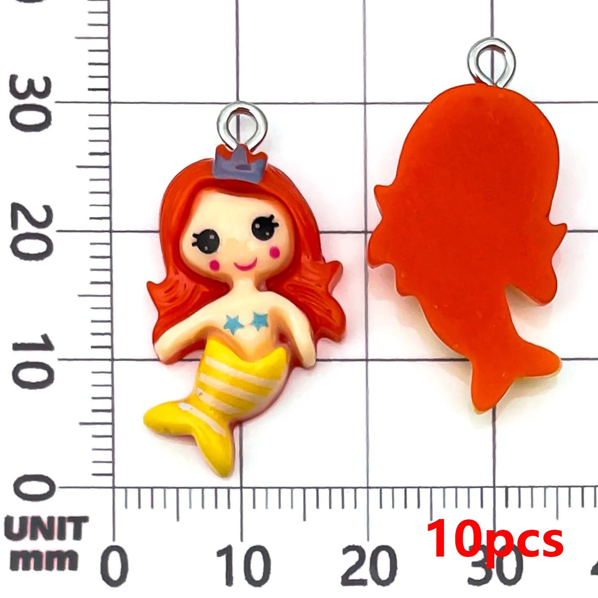 A bright orange resin mermaid princess charm with a crown and a yellow mermaid tail, shown next to a similar piece.