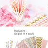 A hand holds a stack of pink and yellow striped and polka dot paper drinking straws.