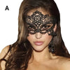 A model wears an elegant black lace masquerade mask with dangling earrings against a dark background.