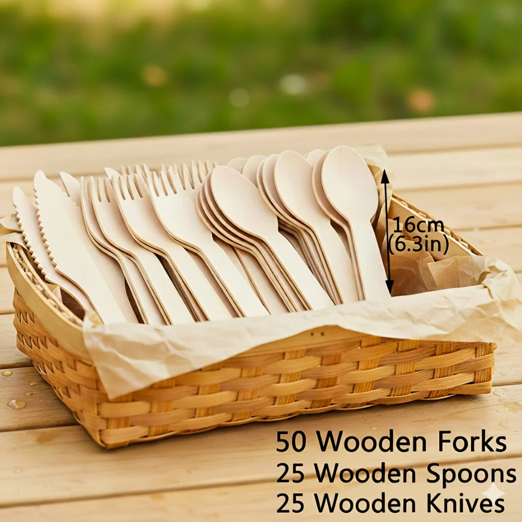 A wooden cutlery set including forks, spoons, and knives is displayed in a woven basket on a wooden surface.