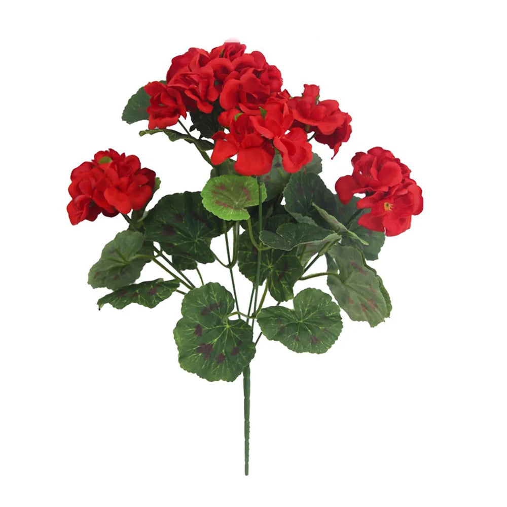 A bouquet of bright red artificial geranium flowers with green leaves.