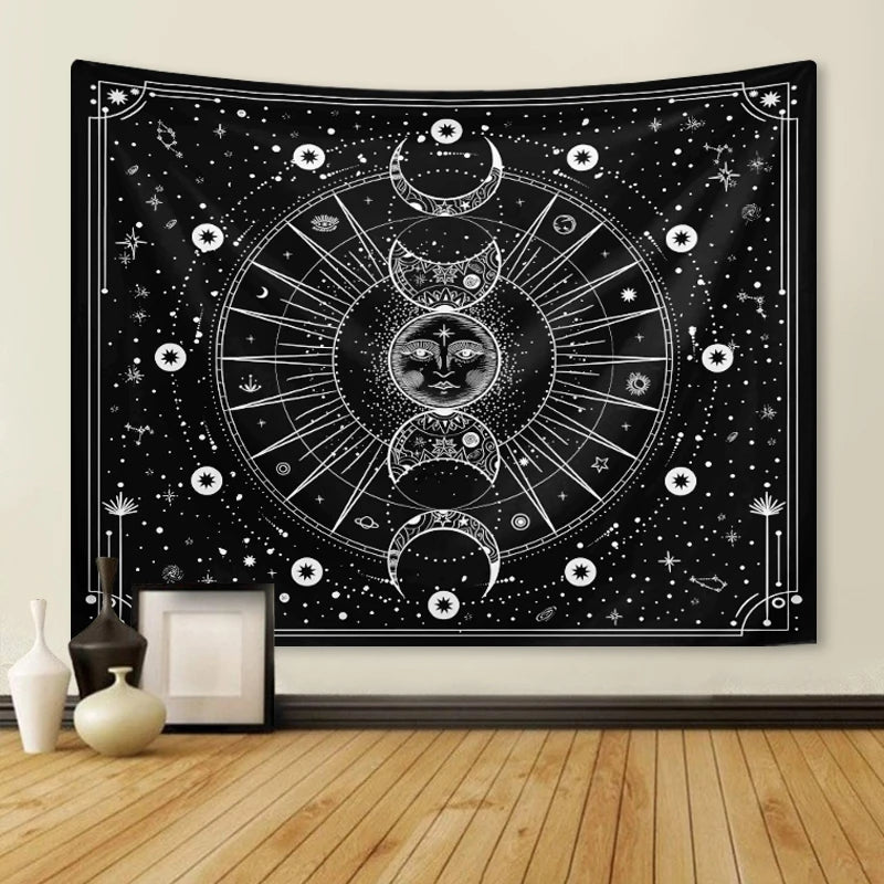 A black tapestry wall hanging featuring a white psychedelic sun and moon mandala design with stars and celestial elements.