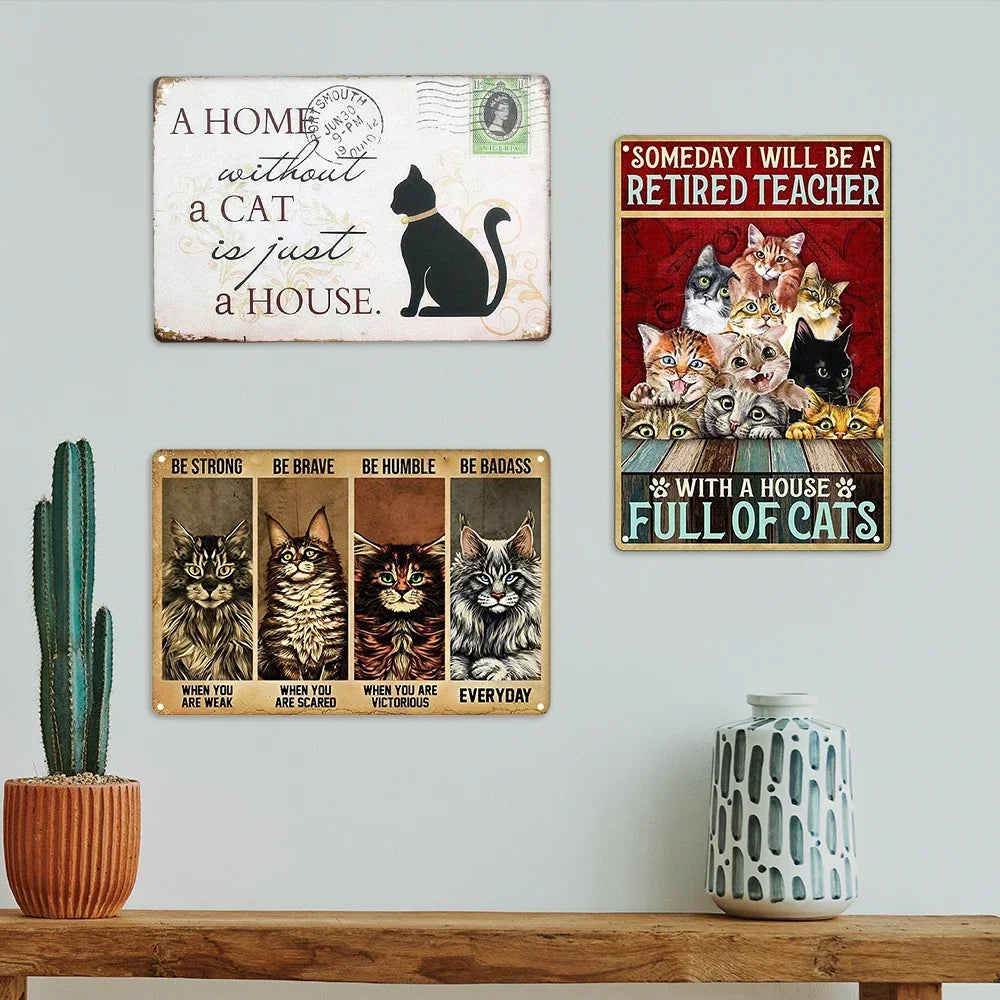 A set of three vintage metal signs featuring cats and funny quotes about cats and houses