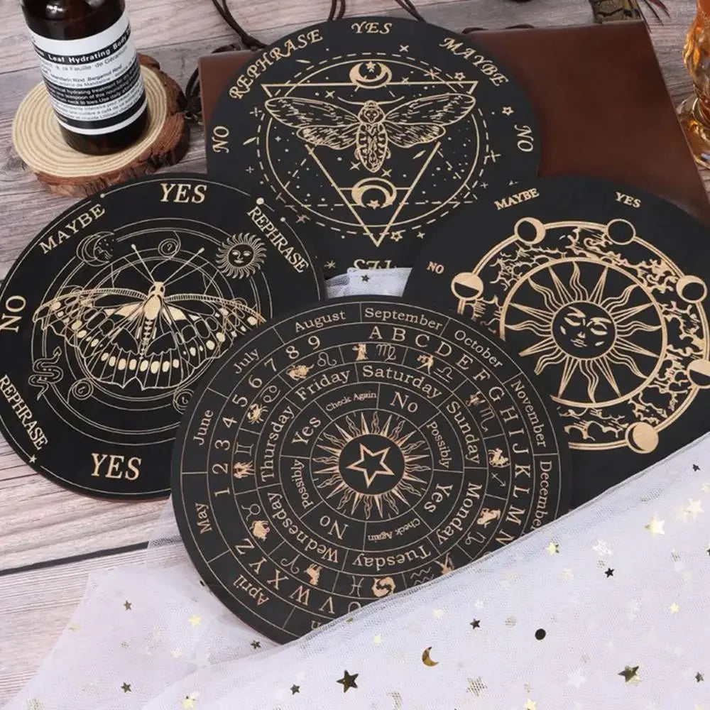 A collection of black wooden divination cards featuring celestial symbols and zodiac signs for meditation