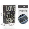 A dark wooden book shaped like a safe with the word LOVE engraved on the cover and a combination lock visible.