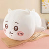 A white Chiikawa Hachiware plush pillow with pink accents resting on a wooden surface.