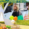 Florence Pugh themed decorative flag banner displayed outdoors with a woman and balloons.
