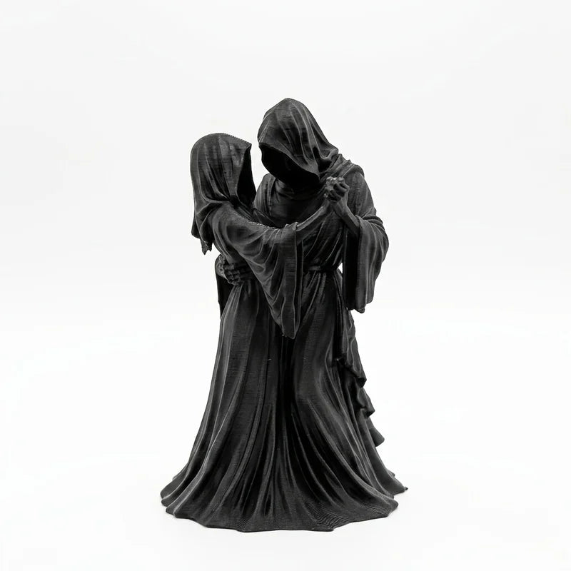A dark romantic sculpture depicting a couple in hooded figures, resembling a Gothic Grim Reaper theme.