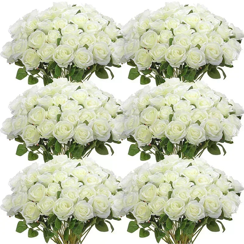 A bouquet of white artificial silk roses arranged for table decor.