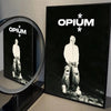 Black canvas wall art featuring a white figure and the word OPIUM in white text with stars.