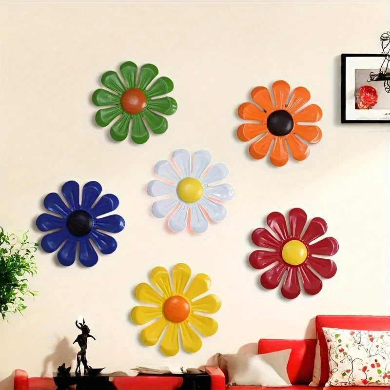 Iron sunflower wall art decor featuring various colored metal flowers on a light wall.
