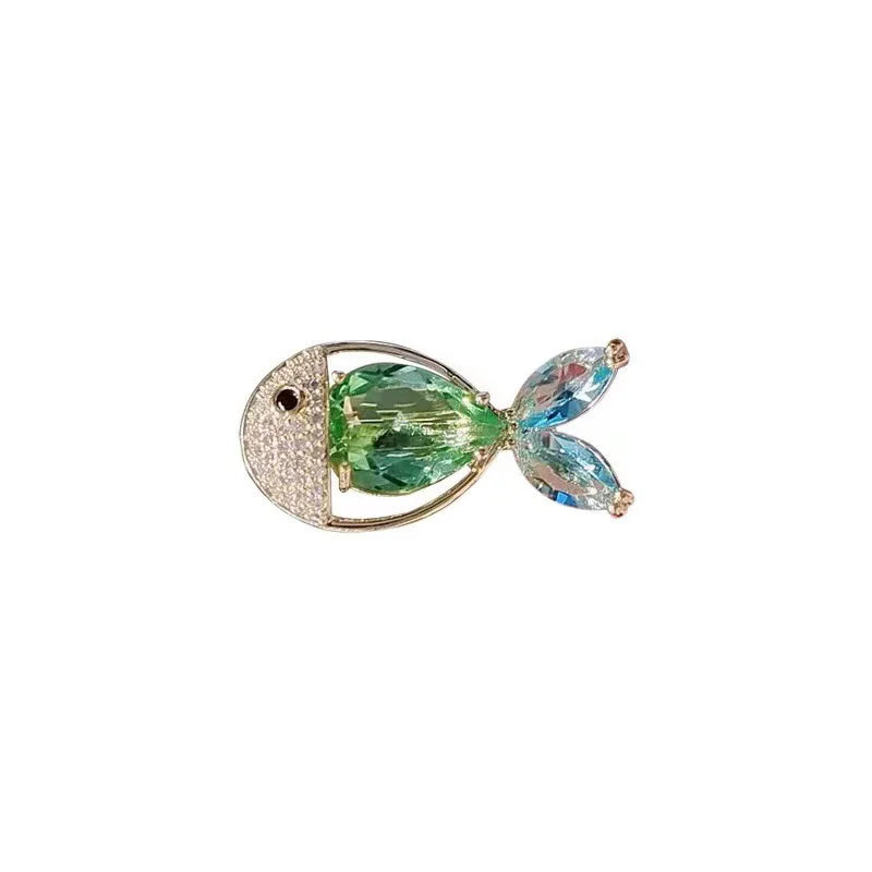 Vintage marine life brooch pin set featuring a green fish and blue fins.