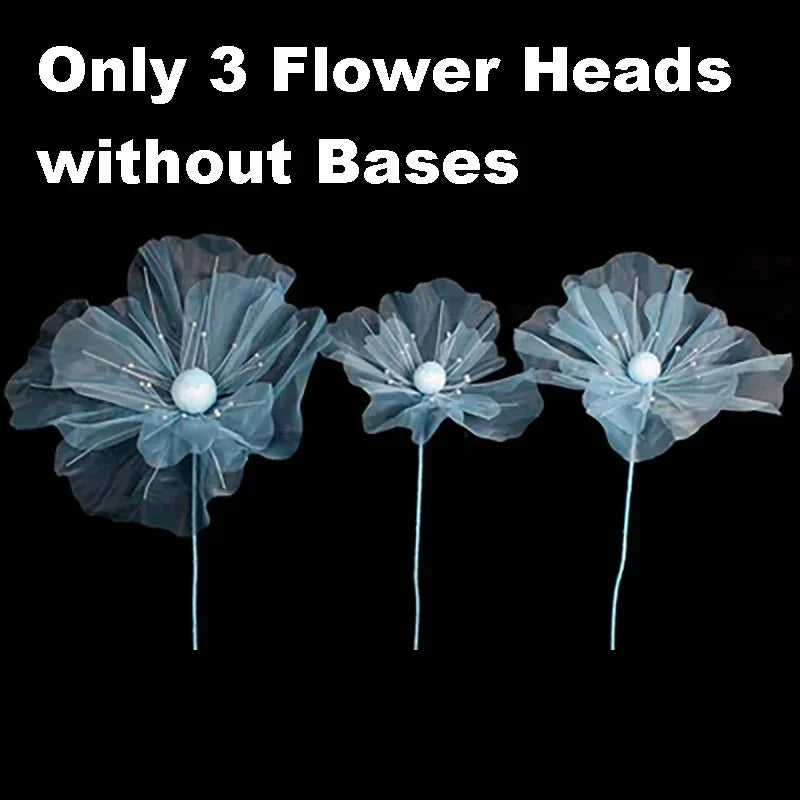 Three light blue velvet mesh flower heads without bases for wedding decoration.