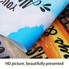 A close-up view of modern abstract floral wall art prints in gold and white on a rolled canvas.