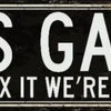 A distressed black metal sign with white text that reads Dad's Garage If he can't fix it we're all screwed