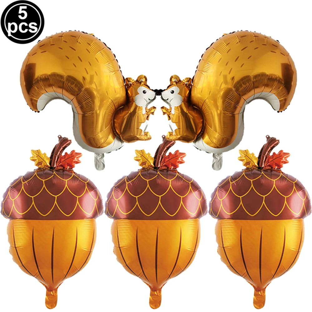 Five gold foil animal ears and three golden pumpkin decorations for birthday party theme