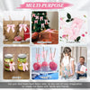 A collection of pink satin ribbon bows and crafting items including gift bags, invitation cards, Christmas tree decorations, 
