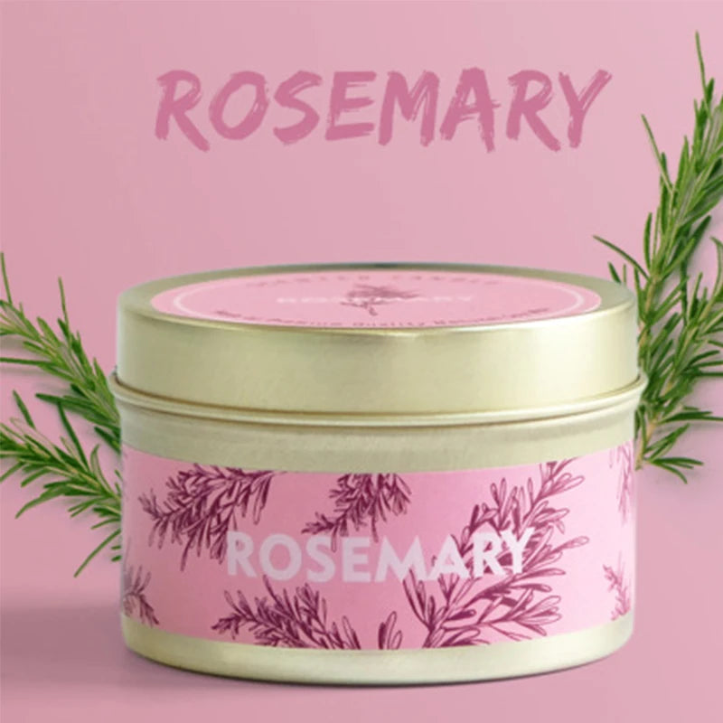 A jar of Rosemary natural soy wax travel candle with a pink label and green rosemary sprigs.