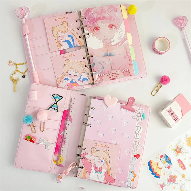 A pink luxury heart pendant diary set featuring a pink cover and decorative elements.