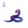 A purple and blue 3D printed articulated snake fidget toy with a textured, scaled appearance.
