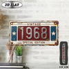 A vintage metal year plaque for 1968 displayed on a white brick wall.