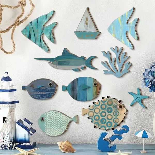 A collection of ten wooden, teal and blue fish shapes are displayed against a white wall.