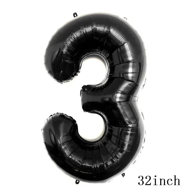A black inflatable number three balloon used for party decorations.