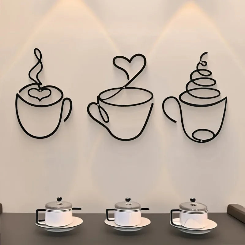 A set of three black line art coffee cup wall decorations displayed on a light gray wall.