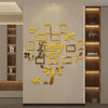 A gold acrylic 3D tree design with the word Family where life begins never love ends mounted on a light wall.
