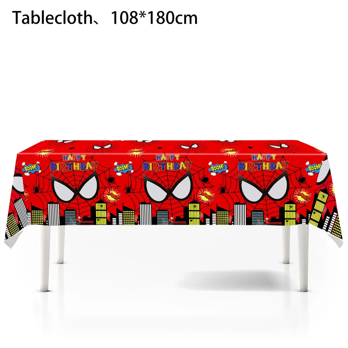 A red tablecloth decorated with superhero themes, including Spider-Man motifs and city skyline silhouettes.