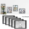 A set of five black picture frames with HD plexiglass for wall display