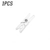A single mini clear plastic spring clip used for holding photos, papers, and crafts.