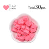 A pile of pink silicone heart beads for DIY jewelry making, totaling 30 pieces.