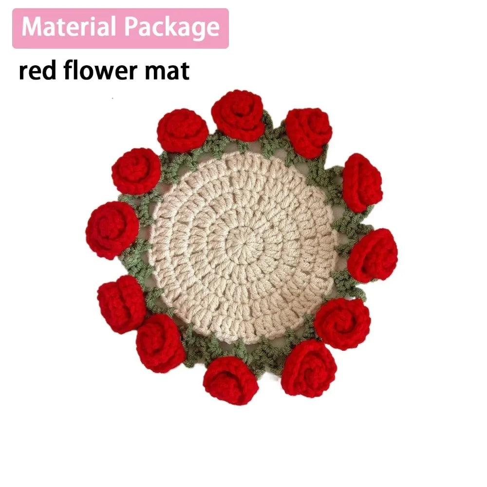 A bouquet of red flower mats made from hand-crocheted fabric.