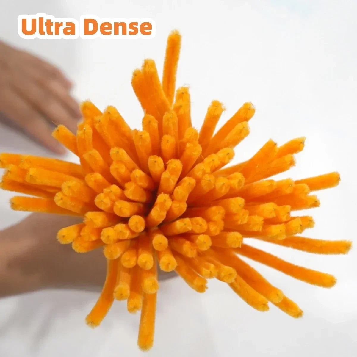 A bright orange pack of chenille stem pipe cleaners used for DIY crafts.