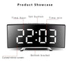 Black LED mirror alarm clock showing 22:03, featuring a curved display and set button.