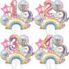 A set of rainbow unicorn foil balloons in pink, purple, and gold colors for a party decoration.