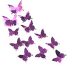 A set of twelve iridescent pink and purple mirror effect butterfly wall stickers.