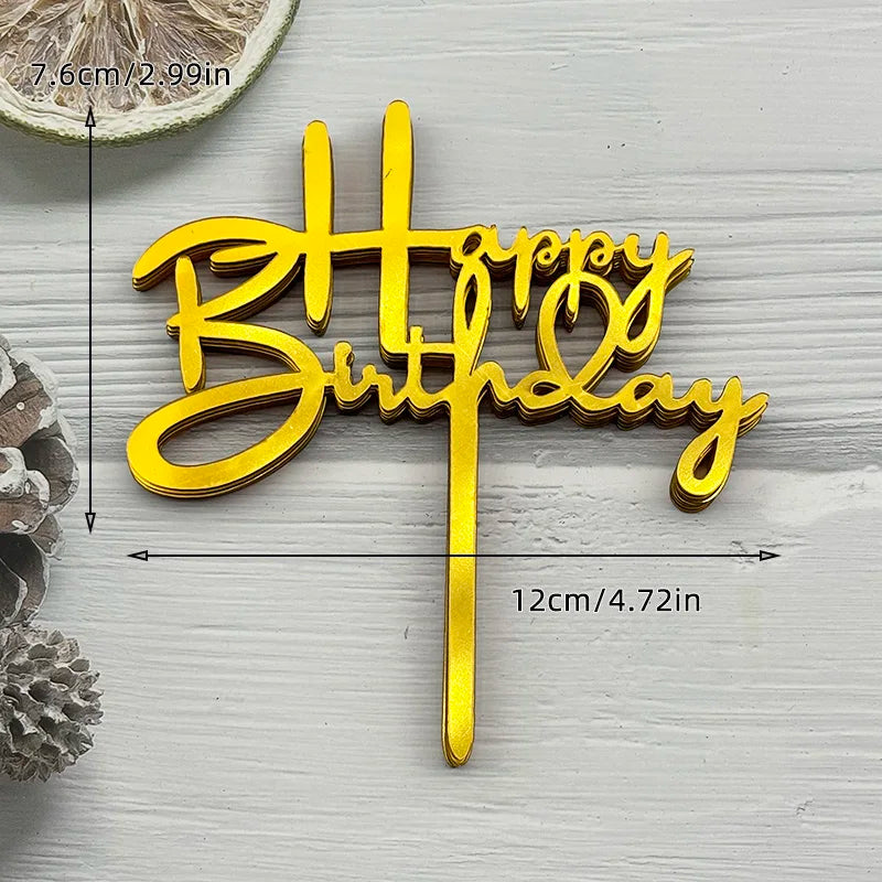 Gold acrylic birthday cake topper with the words Happy Birthday on a stick