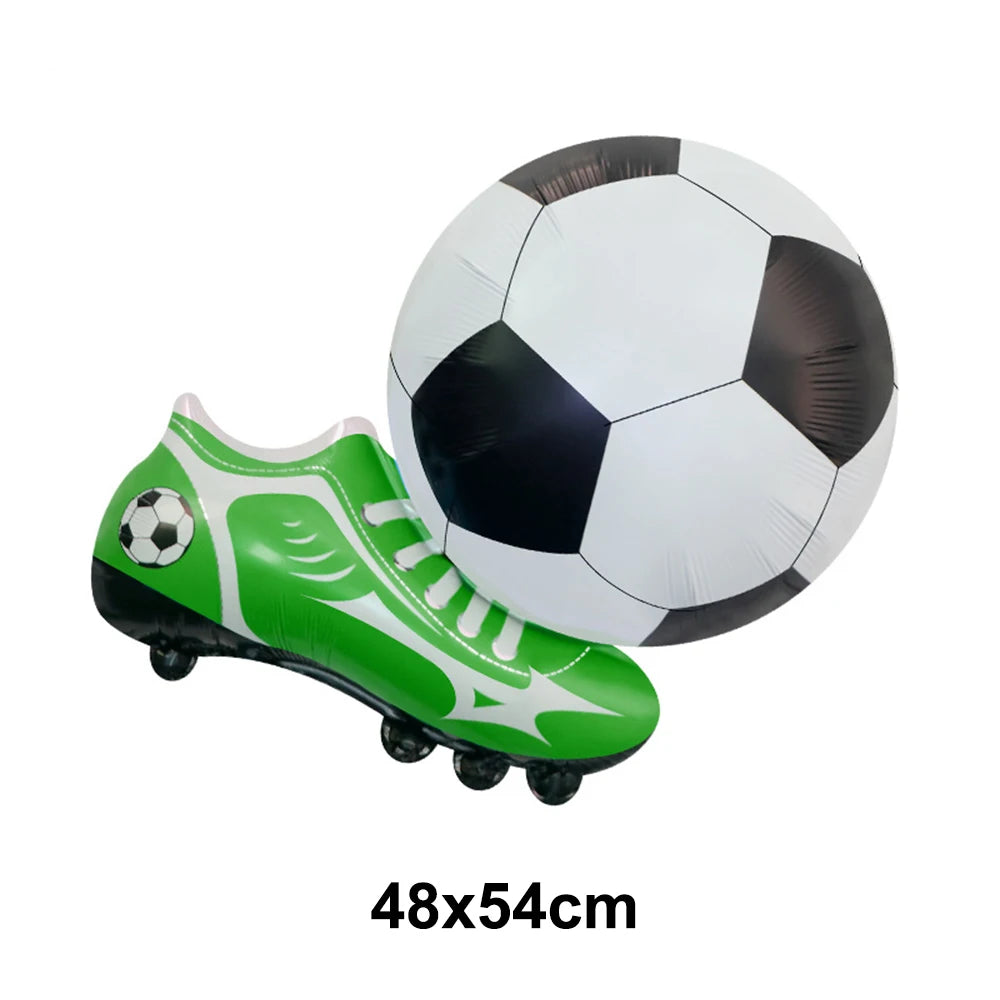 A green and white soccer-themed boot is shown next to an inflated black and white soccer ball.